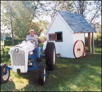 
Recycled barn boards and wagon wheels make this chicken tractor weather tight and easy to move to fresh pasture. By Richard Smith, Lawrence, an.
